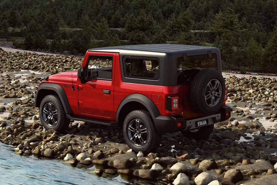 Mahindra Thar 2024 navigating through rugged terrain.