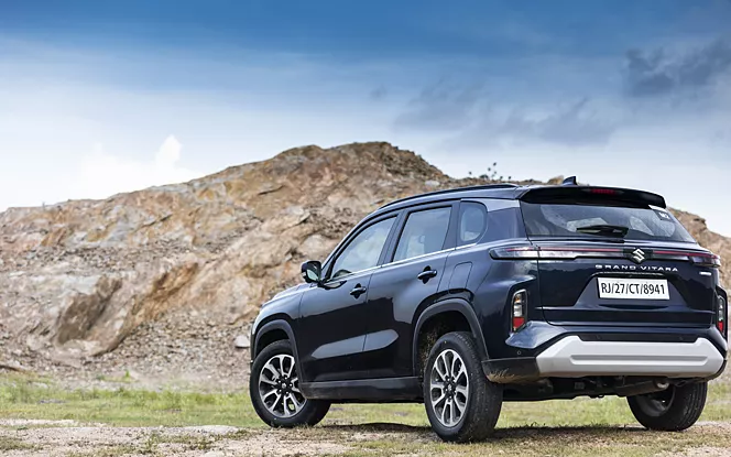 Maruti Suzuki Grand Vitara on a scenic road.